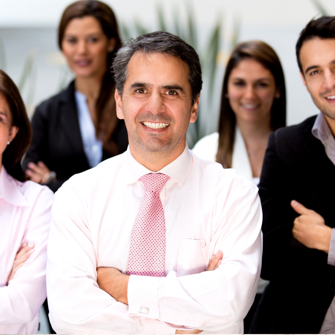 Family standing in front of their home with their dog